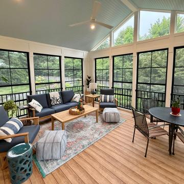 Bright three season room with seating area and dining table