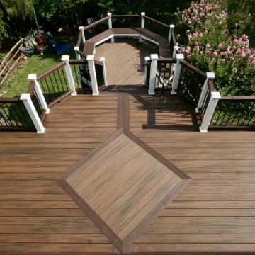 Multi-level backyard deck with contrasting railings and octagonal landing