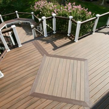 Multi-level composite deck with white posts and black railings